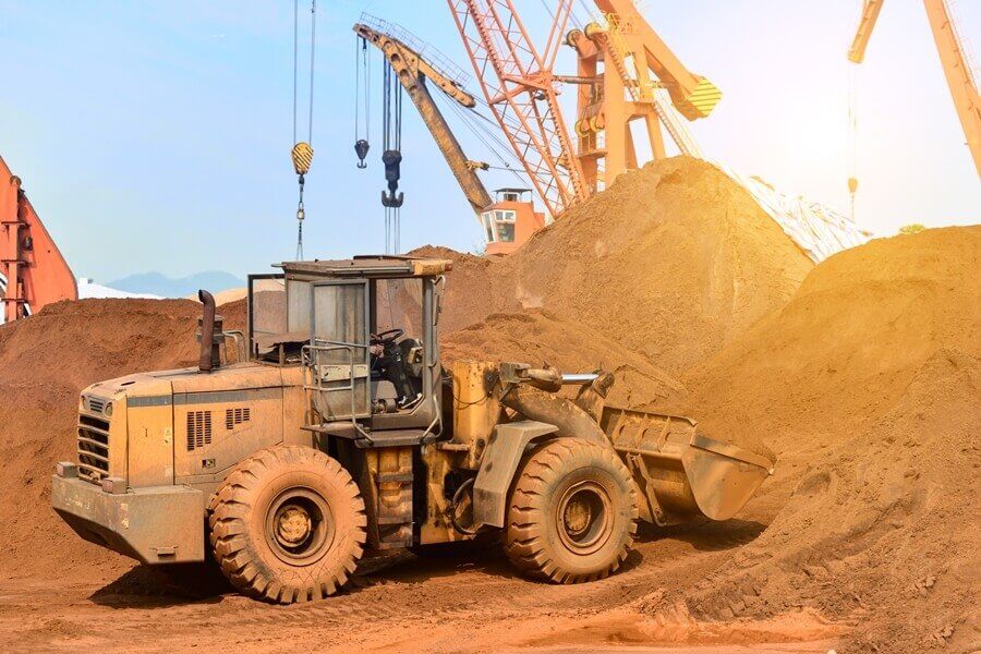 a large tractor parked in the dirt