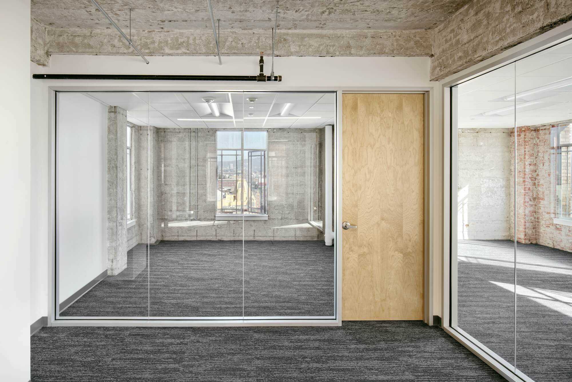 glass wall with wooden door - Commercial office renovation