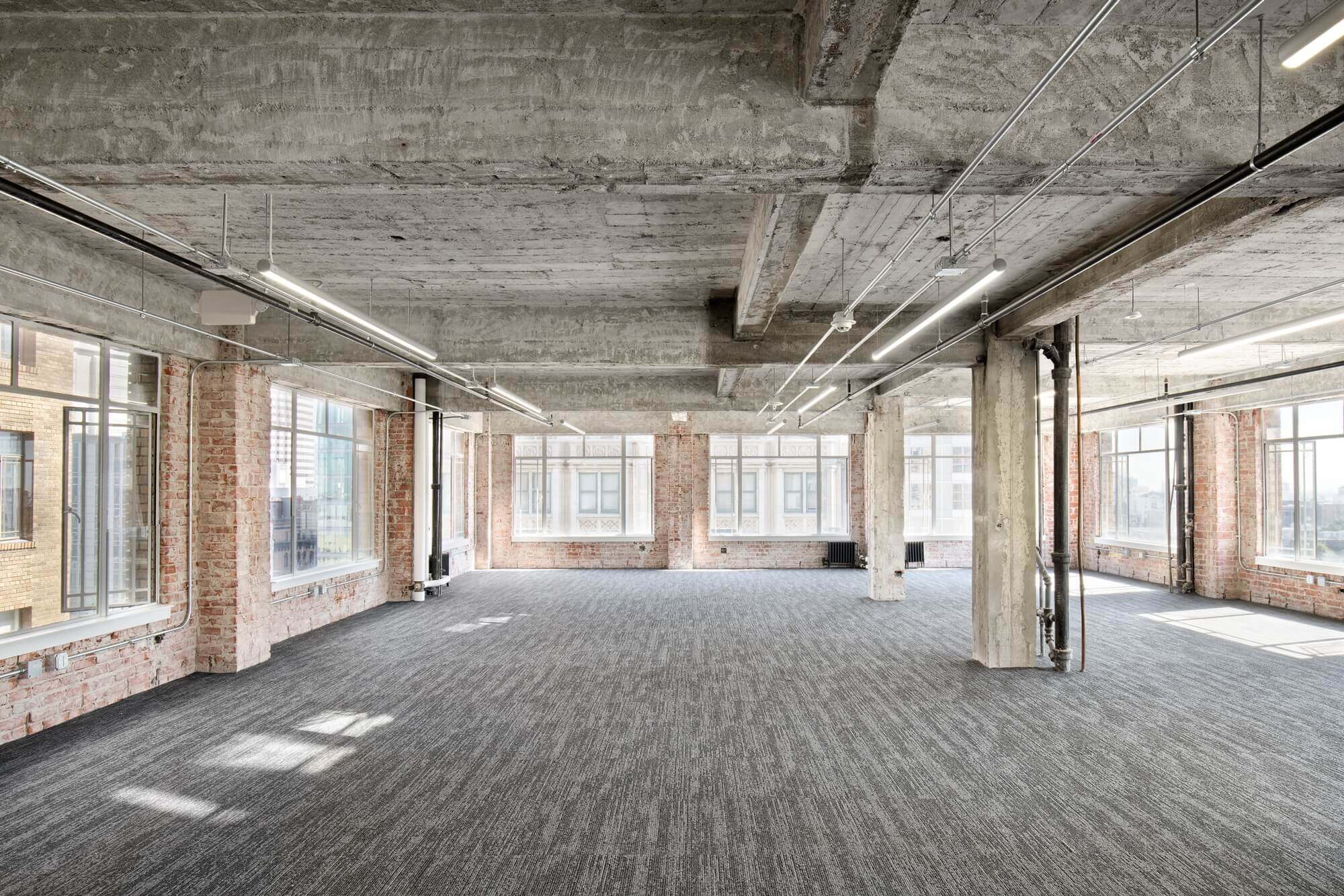 Large open office space construction build with large glass windows