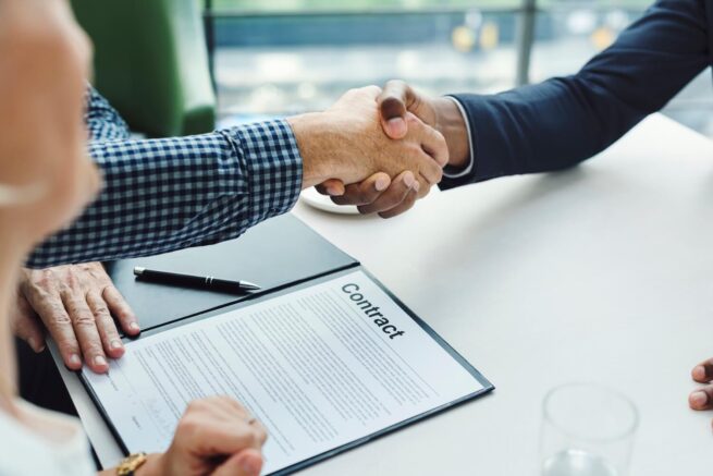 hand shake on commercial construction contract