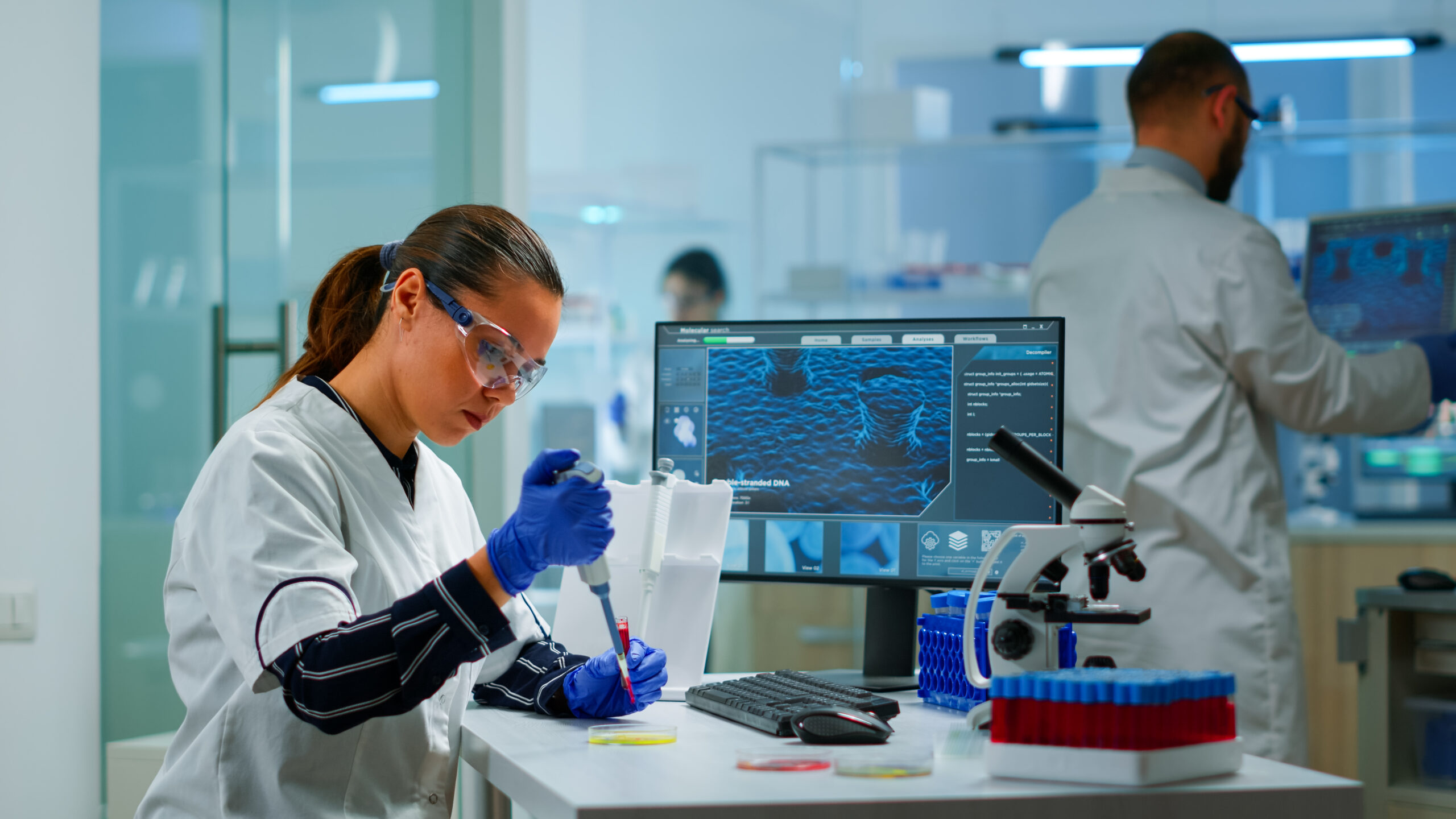 A life scientist working on an experiment in a laboratory.