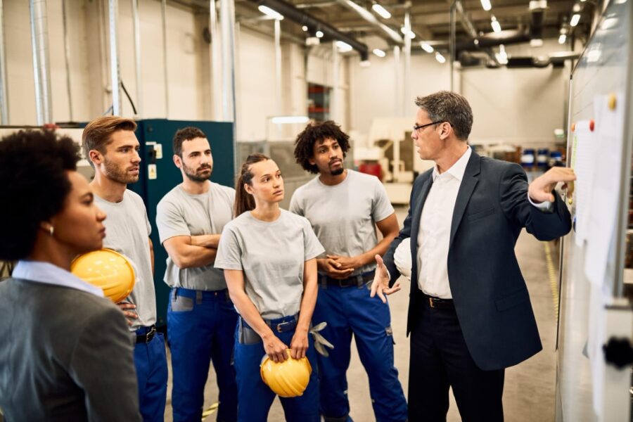safety training session conducted by a project manager and construction workers