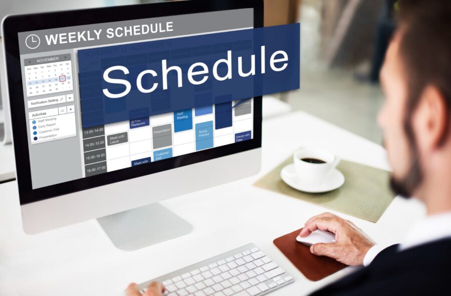 a building contractor developing a construction schedule on desktop