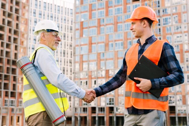 contractor and project owner shaking hands