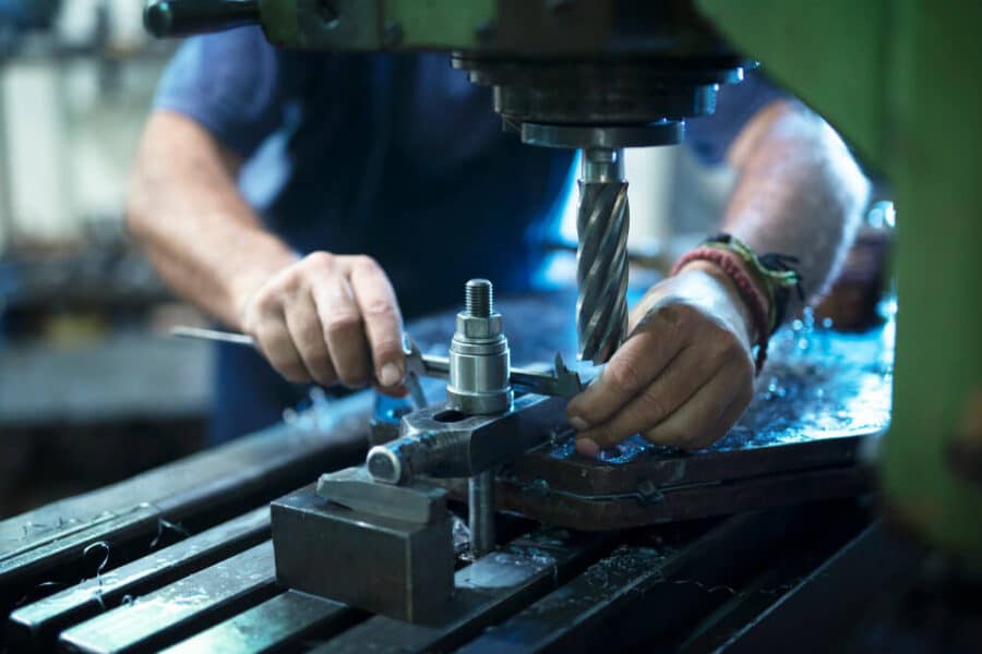 A worker delivering mechanical equipment services.