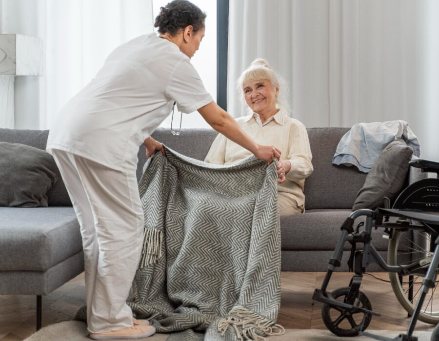 a nurse caring for an old lady on wheelchair