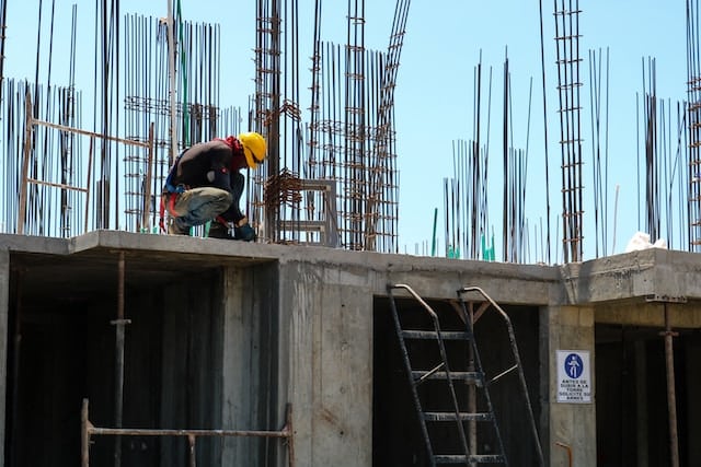 a construction worker busy in seismic retrofit process on site
